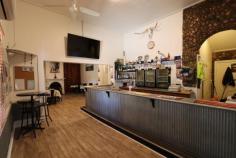 9 Possum Point Road Tumbarumba NSW 2653 $749,000 An Upper Murray river run destination the Tooma Inn dates back to 1879 and is a popular stop over for those travelling the Snowy Valleys Way Touring Route. Situated in one of the most picturesque valleys that boasts stunning views for all 4 seasons - green, snow, autumn and spring colour. Recently renovated the property has been fully painted externally, new roof installed, and the toilets and kitchen have been nicely updated. The bar itself is welcoming with plenty of space for socialising or dining. The big open fire place plus wood heater provide plenty of ambience and warmth during winter. There are 2 hotel rooms 1 x queen and a family room with 1 x queen and 4 singles. A separate residence area with good size living area, main bedroom and private bathroom. There is a good size 4 bay shed providing ample storage. The alfresco and garden area are a new addition and feature a covered area, pizza oven and BBQ area. There is also another large function area great for those casual get togethers. A new addition is the separate lollie and gift shop which has its own entrance and has a deluxe range of sweet delights. School bus can be caught at the front door. Overlooking the Tumbarumba Creek this also provides ample water to the hotel. The large flat area behind the hotel also provides a perfect camping spot and is easily accessed from a side gate. With the newly emerging Australia based travel there is a great opportunity to expand this further. Not interested in running a pub but would like a large historic home with loads of character? The current are open to suggestions and negotiations. Location: The Tooma Inn is adjacent to the Tumbarumba Creek and is located just 25mins to Tumbarumba, 15mins to Murray River/Victoria, Canberra 3.5 hours, 70kms Selwyn Snowfields and 117kms to Thredbo. Would you buy this to live in and call home or keep it as the icon it is or may be both. Trivia...........Did you know the Tooma District was one of ten locations that were shortlisted for the site of Australia's national capital in 1900. It was one of the last to be eliminated prior to the final selection of Canberra as the federal capital? Zoned: RU1 Primary Production Water licence 1: Domestic and Stock - 2 meg per year Water licence 2: Unregulated River..