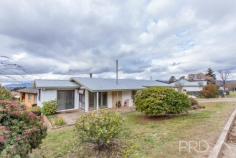 2 Crofton Avenue Batlow NSW 2730 $229,000 Positioned on a generous corner allotment and boasting a flexible internal living space, you will love the position of this well-maintained home in the heart of the picturesque township of Batlow. Boasting three great sized bedrooms, two formal living areas, rear elevated timber viewing deck and abundance of storage options both inside and out. This is an opportunity not to be missed, call today to book your inspection! Premiere Features: - Three great sized bedrooms, master boasting king sized room and built-in robes positioned to one end of the plan - Bathroom with separate built-in bath, separate shower and large single vanity - Galley style kitchen with ample bench space and storage options and electric cooktop - Open plan dining area with wood box fire heater - Formal sun filtered lounge with gas heating options and built-in cabinetry (easily converted to a fourth bedroom) - Secondary lounge/living area positioned to the front of the home with direct verandah access - Internal laundry off the rear of the kitchen - Additional rear mudroom area including a second separate toilet, perfect for outdoor entertaining - Elevated timber viewing deck overlooking the picturesque surrounding hillside - Rear secure workshop area with power and lighting - Single lock up garage/shed with large loft area perfect for additional storage of ski's and fishing equipment - Single carport - Fully fenced rear yard with 2 x additional garden sheds - 802m2 corner allotment - Adjacent H.V Smith Park..