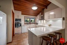 9 Aston Close Coffs Harbour NSW 2450 $850,000 - $900,000 If quality & location are vital attributes in your search for the perfect new home, then this surprisingly interesting property will be sure to please you! This master built home has been lovingly cared for by its current owners for the past 35 years. Offering all the extras you won't see in a modern day construction, the solid timber beams, soaring raked ceilings & cozy sunken lounge with fireplace will please the discerning buyer. With the expansive nature reserve at the rear of the property, the peaceful outlook is a rare bonus to find right in the heart of town - you would not know you were in suburbia. The recently updated kitchen is spacious & beautifully appointed and typifies the light, bright heart of the home we all desire, complete with stone benches, dishwasher & is spacious enough to hold a dance party! The council approved addition of a well equipped studio in the huge 1/4 acre back yard is a valuable asset. Complete with kitchenette & ensuite the studio has a steel frame & is positioned to take in the restful green views over the wooded reserve at the rear of the property. An ideal addition for the extended family, or those wanting to rent out & receive an income from the self contained flat. Located between the two dwellings you will be delighted to find the large salt water pool & outdoor entertaining area. Summers spent cooling off & relaxing by the pool will be enjoyed for years to come. The recently replaced pool pumps & chlorinator should ensure a long & trouble free future. Other attributes that are sure to please are the large under house storage areas & workshop, mezzanine storage in the garage & plenty more storage options in the home. Under the carpet & bamboo flooring, there are hardwood floors throughout the home, should you choose to bring these to life in the future. Both the main home & the studio are air conditioned, and solar hot water panels help with the bills. Gardeners will love the established gardens, fruit trees & veggie garden beds, just waiting to be planted out for the Spring. All in all, this property will tick the majority of boxes on your wish list & please the most fastidious buyer. Located in a very quiet cul-de-sac approximately half way between the town center & the Park Beach Plaza shopping precinct means convenience is at a premium.