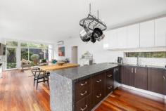 130 Avon Road Rye VIC 3941 $1,695,000 - $1,850,000 An iconic and admired back beach escape, this much-loved family home is perfectly positioned in one of Rye's most sought after and prestigious locations literally footsteps to the surf. Built well ahead of its time and hidden among Moonah trees with the roar of the surf and the National Park only 300m away, this HIA award winning master builder home (Everclear) was crafted for stylish oceanside holidays or a permanent seachange. Designed by architect Emma Tulloch and taking inspiration from mid-century modernism, this could be a just-completed home, but with recent updates gives the impression of a brand-new residence. Boasting a sparkling 8m x 3m in-ground pool, set in beautifully landscaped coastal gardens offering total privacy and sunny sheltered decks to entertain alfresco, the new owners can enjoy a rare synergy with the stunning coastal environment. Just a short stroll to the spectacular Lizard Rock and No.16 beach for an early morning surf, the three-bedroom residence takes you on a journey through intriuging spaces for the ultimate seachange or relaxed weekend getaways. High ceilings and an abundance of north facing glass flood the open plan living area with natural light that connects to the alfresco deck with views over the pool, travertine paved terraces and vine-covered arbor. Stunning leather granite benchtops feature in the kitchen along with a new stainless-steel stove and dishwasher while Italian marble tiles are the floor choice for the bathroom, laundry and powder room. The master bedroom has an outdoor bath and shower, a second large bedroom features its own sitting area that seems to hover in the landscape and a large picture window in the third bedroom perfectly frames the twisted forms of Moonah trees in the front yard. This quiet and seperately zoned bedroom is the perfect guest space hidden behind a sliding door. Set on almost one-third of an acre and full of interest and intrigue at every turn, other features include ducted heating, split-system airconditioning, polished hardwood floors, rooftop solar panels and a remote garage. Hockingstuart | Belle Property is proud to be offering this property for sale. To arrange an inspection or for further information, please contact Mal McInnes on 0415 502 316 mal.mcinnes@belleproperty.com