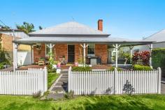 16 Taloumbi Street Maclean NSW 2463 $490,000 - $510,000 This quaint and very charming cottage is located in a prime position within the sought after riverside town of Maclean. The home is spacious in size and is only a short stroll to the Maclean CBD or a hop skip and a jump to the famous Botero coffee Cafe where you can duck out for a fabulous coffee, Breaky or Lunch. The cottage offers 3 bedrooms, a study plus stairs that lead to a loft area with raked ceilings and could be utilized as a 4th bedroom or 2nd living area. The lounge room has high ceilings with a lovely ornate fireplace and the kitchen is neat and boasts a brick feature wall with a separate dining area. The bathroom has been updated and there is a 2nd toilet located on the side verandah. Set on a small 338.7m2 manageable block with low maintenance gardens and yard this attractive old world home is complete with a picket fence and a wide verandah off the front and side of the home where you can sit and watch the world go by.