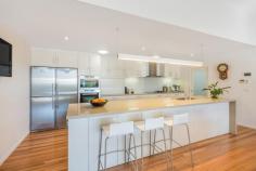 2 Beirne Street Hendra QLD 4011 This beautifully private, north-facing contemporary designed family residence is located in Hendra’s dress circle on a corner 648 m2 lot, with a flexible dual level layout and free-flowing indoor/outdoor living seamlessly opening to a magnificent, covered Sala and landscaped garden. There are multiple zones for effortless alfresco entertaining and relaxation offering the best of contemporary living in a prestigious location. The generous ground floor master bedroom, with a large walk-in robe and superb ensuite, enjoys an adjoining living/media room as a perfect parent’s retreat. There are three additional bedrooms with the two large upstairs bedrooms entering from a substantial TV/rumpus and verandah. Providing excellent storage throughout, including an oversize garage to accommodate cars and workshop, this fabulous residence has it all. Our Lady Help of Christians Primary School is across the road, Hendra shops, restaurant, coffee shops, bus and train transport a very short walk and all within a twenty minute drive to CBD and Airport. Features Include: - Magnificent open plan living, dining, kitchen opening to a large North facing Sala - Seamless indoor/outdoor living flowing to landscaped manicured private garden. - Custom CaesarStone/Miele gas/convection kitchen with breakfast bar and large pantry. - Generous Double LUG with internal access + 3 extra off street parking - Ducted air-conditioning, Solar power, tanks and bore.