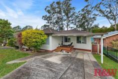 40 Bourbon St Wyoming NSW 2250 A well presented family home in a quiet street of Wyoming with transport and shopping centres close by this home would an array of buyers including the young family, first home buyer, investor or downsizer. - Three bedrooms, main with reverse cycle air conditioning, one with built in robe & all with ceiling fans - Good size main living area which leads into a rumpus room or 2nd living area with air conditioning - Renovated bathroom with wall hung vanity, floor to ceiling tiles, frameless shower screen & bathtub - Well presented galley style kitchen with ample storage - Timber floors throughout the living areas and carpet to the bedrooms - Full length entertaining deck at rear overlooking the large yard and reserve at rear - Internal laundry - Access through a gate to the reserve which leads you onto Alan Davidson Oval so plenty of space for the kids - Single carport and covered deck area to the entry of the home