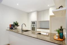 34/18 Kennedy St Kingston Place Kingston ACT 2604 $485,000 Stage One - Kingston Place, positioned in the heart of old Kingston, offers the astute purchaser the best of both worlds: a near-new residence with luxury finishes, common-sense design features and a tranquil position. Finished with a combination of granite Benches, Gaggenau appliances (including induction cooktop, oven and microwave), glass splash-back, full height and feature tiling to wet areas, built-in shelving for entertainment equipment, ducted heating and cooling, floor-to-ceiling glass sliding doors from both the living room and bedroom, high ceilings and walk-in robe offering plenty of storage and hanging space; this home presents as the ideal residence for the discerning executive couple. Imagine your new home situated conveniently within walking distance to the village lifestyles afforded by Kingston and Manuka, yet also having an expansive, fully enclosed and paved outdoor north-facing courtyard with planter boxes; enabling a seamless flow from the luxury-appointed, open-plan kitchen, lounge and dining areas into your outdoor entertaining areas complete with the serenity and privacy offered by this desirable location. Property sold with vacant possession. Features: • Gaggenau kitchen appliances with induction cooktop, oven and microwave; • Granite benchtop; • Built-in shelving for entertainment equipment and desk area in living room; • Spacious walk-in robe; • Lift access; • Stone bathroom benchtops with double vanity; • European laundry; • Secure building with Audio visual intercom entry; • Fully ducted, reverse-cycle air conditioning; • Ducted reverse-cycle AC; • ADSL2 and Foxtel connection points; • Living area of 72 m2 and Terrace-courtyard of 53 m2; and • One allocated parking space and lockable storage cage in secure underground garage. • Security System