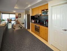 56 Bellimos Drive Wandina WA 6530 Situated in the heart of Bellimos Drive, this property is simply oozing with quality, a modern feel and executive living. This home was designed to capture an unobstructed ocean view from the open kitchen, living and bar area, offering an outlook to the back yard. This is your comfortable private space with a lovely elevated outlook. Other appealing features include: Good sized, master bedroom with a walk-in robe ensuite bathroom & split system air-conditioning Three queen-sized minor bedrooms with built-in robes and two minor bedrooms with ocean views Separate formal lounge/theatre Large gable patio, over looking the lawn and garden area Double garage allowing access to the patio Great sized, easy to maintain back yard Functional laundry with storage space