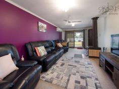 19 Mullins Rd Killara VIC 3691 $305,000 Tucked away from the street behind established trees and a private front fence sits this three bedroom home in popular Killara. Within close proximity to wetlands, walking tracks and the Kiewa River and only a short commute to Wodonga CBD, this property offers a beautiful lifestyle option within the city limits. - Three bedrooms all with built in robes, - Lounge room fitted with a split system heating and cooling unit and wood fire heater, - The kitchen is practical with electric cooking, ample storage and breakfast bar, - Dining room adjacent to the kitchen or ample room for a eat in kitchen, - Bathroom with shower over bath, laundry and separate toilet all located to the rear of the home, - Undercover entertaining area accessible from the lounge, - Low maintenance yard, perfect for pets or kids to play, - Approximately 10m x 6m powered shed with an additional wood shed behind, - Currently rented for a modest $245 per week with rent potential to be increased to $310 per week.