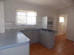 25 Margaret St Yarraman QLD 4614 $245,000 In these changing times, where people from the south move to Queensland and big city dwellers recognize the value of the big open spaces, here is a wonderful opportunity to live in a rural township where the Toowoomba council is improving the surrounds and residents are banding together to make it a great living. Everything is in walking distance, school, bank, doctors, bakery, cafes, butcher, produce place, IGA. The house has a friendly, open and light energy. The bathroom is large with shower and bath tub and instant gas hot water. The front veranda extends from one end of the house to the other, opening into a large square at the front entrance. At the back is a ramp for ease of access to the house. 2 beautiful poinciana trees at the front act as a barrier between the road and house and are an amazing view to wake up in the morning.The bedroom has french doors that open onto the veranda. Also trees are planted along the fence line for privacy and as wind break. A large water tank ensures plenty of drinking water. A double carport is at the back and a greenhouse for use as you please.