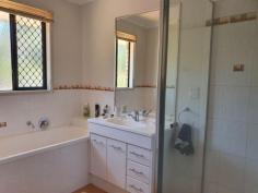 10 Rosalie Dr Yarraman QLD 4614 $450,000 This 3 bedroom brick home is set on 4041m2 on a corner position . The house has an ensuite, built-ins, ceiling fans , reverse cycle air con. , security screens, tinted windows , insulation , 5w solar power & town & tank water. The modern kitchen has a an electric oven, cook top, rangehood & dishwasher, two way , giving entry to the dining room & lounge room. While you are sitting on the patio having a cuppa, you get to relax, with the great views over looking the township of Yarraman. This property has well established terraced gardens, Plus a 3 bay all steel garage (approx. 20mt x 9mt ) with an entertainment area, toilet, shower , pot belly wood heater, stove , & enough room to store a large caravan in the carport,