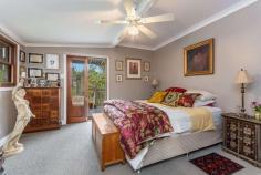 9 The Glen Maclean NSW 2463 $850,000 - $870,000 This stunning Queenslander style home is in an elevated position with lovely surroundings and is located in a quiet cul-de-sac where you have a nice outlook from every room. Inside the home you are welcomed by high ceilings and beautiful timber French doors that gives it that country charm, which is also felt throughout the home. The spacious open plan living area combining the lounge room, dining and kitchen is the heart of the home and offers lots of natural lighting and great cross breezes. The kitchen boasts a large gas smeg stove with electric oven and a large country style sink. There are 4 bedrooms in total with 3 featuring built -in wardrobes, and ceiling fans. The master bedroom boasts a walk-through-robe and stunning ensuite plus French doors that open onto the spacious deck area, as does two of the other bedrooms. The charming main bathroom offers a claw foot bath, shower and vanity combined with a separate toilet. The outside of the home can be enjoyed all year round with the wide veranda's that run the length of the home both front and back including a large elevated entertaining area off the kitchen. Perfect for unwinding and entertaining friends and family whilst enjoying the tranquil gardens below. The backyard is divided into two separate areas, the house yard is fully fenced, so is perfect for pets. Downstairs the property features a large double garage with remote control roller door and a 3rd toilet. There is space to add an additional room under the home if needed. This property is set on a large allotment of 1,174m2 with beautiful established trees and gardens that add to the great street appeal of this truly unique home. Located in the popular riverside village of Maclean, which is an area that is becoming hot property in the Clarence Valley.