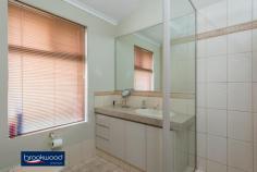 3 Minora Way Jane Brook WA 6056 $515,000 Embrace life in Jane Brook, confident in the knowledge that this home will adapt to the changing needs of a growing family. Multiple living areas, a separate adults’ zone, generous junior bedrooms, and a large media/activity room create a flexible floorplan with a spacious open plan kitchen/meals/family room at its heart. 4 bedrooms 2 bathrooms 2005-built brick and tile Formal & informal living Sep media/activity room Central open plan design Reverse cycle ducted AC Wrap-around alfresco ent 16-panel 3kW solar array Low maint 576 sqm block Parks, lakes, Hills, Valley This spacious family home sits behind the sweep of a green lawn and steps from the open space of Jane Brook Reserve. The front door opens into a tiled entryway with a formal lounge to one side and the spacious main suite to the other. The sunken lounge offers a quiet, east-facing sanctuary away from the activity of the central open plan. In the principal suite, a large bay window delivers ample natural light to a room finished in a calming neutral colour scheme. A walk-in robe and well-appointed ensuite build on the atmosphere of a private retreat. At the heart of the home is an expanse of open plan living with an adjoining activity media room. This flexible design delivers the freedom to adjust to changing priorities as your family grows and needs change. The kitchen is set in one corner of the open plan area and features a 4-burner gas hob, an electric wall oven and a walk-in pantry. A shoppers’ entry, ample under bench storage and an integrated breakfast bar make daily life a little easier. With space for a family-sized sofa and table and access to the wrap-around verandah, this family hub is sure to provide the backdrop to years of memories. Double doors open to reveal a large media/activity room and expand the functional living space. A gas bayonet in this room supplements ducted reverse cycle AC throughout the home. In the separate junior wing, three good-sized bedrooms with carpet and built-in robes are sure to delight children of all ages. A shared family bathroom with tub, shower and vanity, a separate WC and a walk-through laundry complete the layout of the junior wing. A sliding glass door connects the central living zone to a paved wrap around verandah with the 2-car garage at one end, and a Colorbond garden shed at the other. This expansive area, edged with raised garden beds, offers year-round outdoor living with both northerly and westerly aspects. Steps from the front door of this home is a reserve and walking path leading to the lakes and parks of Jane Brook. The shops and services of Midland are a short drive away, and primary and secondary schools are within easy reach. A Foothills setting delivers the outdoor adventure of the Perth Hills and the gourmet delights of the Swan Valley in equal measure.