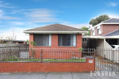 5 Bunbury St Footscray VIC 3011 Located in a quintessential, accessible and central pocket of Melbourne’s Inner West; revel in an unsurpassable opportunity to restore and revive this three-bedroom, brick house which also includes a self-contained studio at the rear. Upon entry to the home, original floorboards guide you to the generous living area that is enveloped in light. Large windows, which overlook the street’s established trees, allow for sunlight to fill the space throughout the day. This area seamlessly flows to the dining room that boasts the same bright and warm ambiance. The large and airy kitchen continues to impress. Cooking is made effortless with stainless steel appliances, tiled splashbacks and flooring and an abundance of storage space. The bedrooms arouse feelings of comfort and calm with carpeting and large windows. Two of the three bedrooms have built in robes which provide storage for the rooms. The home is serviced by a central bathroom with an oversized shower, separate toilet and is completed by a walk-through laundry. Positioned on approximately 380m2 of land, the home boasts a large backyard lined with established rose bushes, peach and walnut trees. It also hosts a large shed alongside the studio. Located approximately 6kms from Melbourne’s city, enjoy a plethora of sensational amenities. Step outside your door and relish in stunning CBD views which becomes a prime viewing post for NYE fireworks or take a leisurely stroll on the scenic Maribyrnong River trail just meters away. For more ambience, all within a short walk, enjoy some of the best restaurants, bars and events in Melbourne’s West such as Lickety Split and the annual St Jerome’s Music Festival. Footscray Train Station, tram and bus stops and access to the Freeway are all just a hop, skip and jump away. Additional Features include: – Undercover car port – Large front garden – Gas stove – Gas hot water service – Split system heating and cooling – Side walkways on either side of the home to the backyard