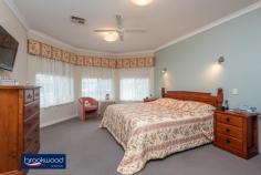 3 Minora Way Jane Brook WA 6056 $515,000 Embrace life in Jane Brook, confident in the knowledge that this home will adapt to the changing needs of a growing family. Multiple living areas, a separate adults’ zone, generous junior bedrooms, and a large media/activity room create a flexible floorplan with a spacious open plan kitchen/meals/family room at its heart. 4 bedrooms 2 bathrooms 2005-built brick and tile Formal & informal living Sep media/activity room Central open plan design Reverse cycle ducted AC Wrap-around alfresco ent 16-panel 3kW solar array Low maint 576 sqm block Parks, lakes, Hills, Valley This spacious family home sits behind the sweep of a green lawn and steps from the open space of Jane Brook Reserve. The front door opens into a tiled entryway with a formal lounge to one side and the spacious main suite to the other. The sunken lounge offers a quiet, east-facing sanctuary away from the activity of the central open plan. In the principal suite, a large bay window delivers ample natural light to a room finished in a calming neutral colour scheme. A walk-in robe and well-appointed ensuite build on the atmosphere of a private retreat. At the heart of the home is an expanse of open plan living with an adjoining activity media room. This flexible design delivers the freedom to adjust to changing priorities as your family grows and needs change. The kitchen is set in one corner of the open plan area and features a 4-burner gas hob, an electric wall oven and a walk-in pantry. A shoppers’ entry, ample under bench storage and an integrated breakfast bar make daily life a little easier. With space for a family-sized sofa and table and access to the wrap-around verandah, this family hub is sure to provide the backdrop to years of memories. Double doors open to reveal a large media/activity room and expand the functional living space. A gas bayonet in this room supplements ducted reverse cycle AC throughout the home. In the separate junior wing, three good-sized bedrooms with carpet and built-in robes are sure to delight children of all ages. A shared family bathroom with tub, shower and vanity, a separate WC and a walk-through laundry complete the layout of the junior wing. A sliding glass door connects the central living zone to a paved wrap around verandah with the 2-car garage at one end, and a Colorbond garden shed at the other. This expansive area, edged with raised garden beds, offers year-round outdoor living with both northerly and westerly aspects. Steps from the front door of this home is a reserve and walking path leading to the lakes and parks of Jane Brook. The shops and services of Midland are a short drive away, and primary and secondary schools are within easy reach. A Foothills setting delivers the outdoor adventure of the Perth Hills and the gourmet delights of the Swan Valley in equal measure.