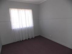 25 Margaret St Yarraman QLD 4614 $245,000 In these changing times, where people from the south move to Queensland and big city dwellers recognize the value of the big open spaces, here is a wonderful opportunity to live in a rural township where the Toowoomba council is improving the surrounds and residents are banding together to make it a great living. Everything is in walking distance, school, bank, doctors, bakery, cafes, butcher, produce place, IGA. The house has a friendly, open and light energy. The bathroom is large with shower and bath tub and instant gas hot water. The front veranda extends from one end of the house to the other, opening into a large square at the front entrance. At the back is a ramp for ease of access to the house. 2 beautiful poinciana trees at the front act as a barrier between the road and house and are an amazing view to wake up in the morning.The bedroom has french doors that open onto the veranda. Also trees are planted along the fence line for privacy and as wind break. A large water tank ensures plenty of drinking water. A double carport is at the back and a greenhouse for use as you please.