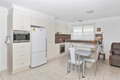 2/9 Witherington Ave Ulladulla NSW 2539 Enjoy easy care living in this immaculate duplex offering incredibly spacious living and generous rooms throughout. The living areas and gourmet kitchen, bathroom and laundry are on the ground floor with access to the private courtyard with covered patio and fully fenced grassed yard. The home features a wide staircase with chair lift already in place for long term living leading to the upstairs bedrooms, the main with luxury ensuite and walk-in-robe. With a spacious double garage and plenty of off-street parking, there is space for everything. Spend your mornings on the upstairs balcony taking in the distant ocean views, or take a short stroll into Ulladulla and take advantage of having the CBD, restaurants, schools and harbour on your doorstep.