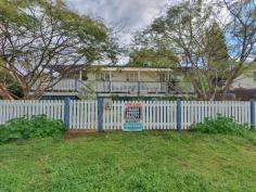 25 Margaret St Yarraman QLD 4614 $245,000 In these changing times, where people from the south move to Queensland and big city dwellers recognize the value of the big open spaces, here is a wonderful opportunity to live in a rural township where the Toowoomba council is improving the surrounds and residents are banding together to make it a great living. Everything is in walking distance, school, bank, doctors, bakery, cafes, butcher, produce place, IGA. The house has a friendly, open and light energy. The bathroom is large with shower and bath tub and instant gas hot water. The front veranda extends from one end of the house to the other, opening into a large square at the front entrance. At the back is a ramp for ease of access to the house. 2 beautiful poinciana trees at the front act as a barrier between the road and house and are an amazing view to wake up in the morning.The bedroom has french doors that open onto the veranda. Also trees are planted along the fence line for privacy and as wind break. A large water tank ensures plenty of drinking water. A double carport is at the back and a greenhouse for use as you please.