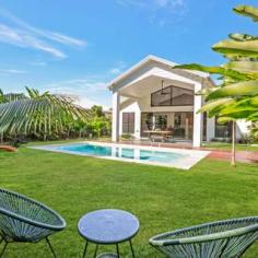 55 Argentea Boulevard Palm Cove , QLD 4879 HOUSE FOR SALE IN PALM COVE A Stunning Executive Home With The WOW Factor! 4 Beds 3 Baths 2 Cars This high-end residence is the embodiment of lifestyle living; sophistication, quality, style, and luxury, only moments' walk to the palm fringed shoreline of Palm Cove, with award winning restaurants and bars. Thoughtfully designed for our Far North Queensland lifestyle, this Palm Cove home boasts the perfect balance of 2 worlds - beachside living and rainforest tranquility, offering space, privacy, and elegance in a truly exquisite design. The contemporary architectural layout comprises of two grand master bedrooms with ensuites, two generous sized bedrooms in the "guest wing" and a total of three grandiose bathrooms with accompanying bathtubs. Under a magnificently high ceiling, the beautiful galley style kitchen overlooks the grand living/dining room and spools out to the private sparkling in-ground pool, enveloped by a lush tropical garden overlooking the tranquil rainforest backdrop. Located on a 720 m2 allotment in Argentea and backing onto rainforest reserve TWO main bedrooms with WIR and luxury ensuites "Guest wing" with two spacious bedrooms Grand entrance with garden and accompanying pond feature Large galley style kitchen with a large island ceasarstone benchtop Idyllic covered alfresco poolside area with plenty of space for entertaining the family 600 x 600 marble look porcelain tiles throughout All bathrooms include ceasar stone tops, and sizable bathtubs in both ensuites; Fully air-conditioned and LED lighting throughout Stunning pool with glass fencing, and low maintenance garden beds Double lock-up garage with fully tiled floor Backing onto natural creek There is potential to develop the backyard even further with enough space for a gazebo or outdoor entertaining area by the pool (subject to Council approval). Ray White Smithfield Precision and luxury meet tropical living in this must-see property! For more information or to arrange your inspection contact Ned McLachlan on 0412 885 734 or email ned.mclachlan@raywhite.com. Land: 720m² / 0.18 acres Parking: 2 garage spaces Bedrooms: 4 Bathrooms: 3