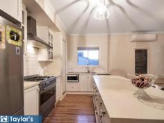 27a Amundsen Drive Ingle Farm SA 5098 $555,000 - $595,000 Buy today and move in within 90 days. This is your chance to secure a huge 5 bedroom plus study family home with an amazing back drop of trees and wild life. This substantial 275.27sqm home features five double sized+ bedrooms, 2.5 bathrooms and generous living areas on both levels. With Inspired architectural design and landscaping, this stunning split-level family home boasts an abundance of space and flexibility for live in extended family. Your new home is now ready and waiting for your family to move in and enjoy. Where better to entertain guests or unwind after work than on this vast timber deck overlooking the meandering creek and leafy reserve. Modern convenience delivers a ground floor master bedroom suite with the finest ensuite you could imagine. relax in the freestanding claw-foot bath, or wash away the day in the double-sized shower. Complete with a walk-in robe, this is the master bedroom everyone dreams of! Also at ground floor level, bedroom 2 could be a formal lounge, home theatre or home office. Another 3 double sized bedrooms await upstairs, along with a second (or third!) living area, large enough to cater a dining table and lounges for separate living upstairs or use it as a huge teen retreat, a separate large study nook/kitchenette area, balcony off living area and a family bathroom. Features include: - One-owner home built to impeccable standards in 2013 - Low-maintenance, landscaped 425sqm allotment (approx.) - 5-star kitchen boasting 900mm gas cooktop, oven and rangehood, walk-in pantry, island bench with breakfast bar, double sinks, abundant bench and cupboard space. - Guest powder room downstairs plus ensuite to master bedroom and family bathroom upstairs - Bedroom three features a study area/play room/dressing room/walk-in robe, this extra space is large enough for a king single bed and dresser for extra guests to enjoy comfortably (2 rooms in one) while bedrooms 4 & 5 are huge - Two commercial grade reverse cycle air conditioners - Separate laundry with built-in cabinetry - Understairs storage - Driveway parking for two cars with council approval for a double carport, should you wish to install one - Beautiful tree-studded views from many aspects within the home This most sort after location is close to local bus stops, Ingle Farm Shopping Centre and a choice of schools, parks, reserves and local shops.