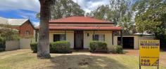26 Hampton St Northam WA 6401 $328,000 This 1932’s character home is complete with 3-bedroom 1-bathroom, brick, iron roof and fixtures throughout featuring tiled flooring and carpet. This property is situated near the river, Northam High School and only a 10min walk into the main shopping centre. Making our way through the front entrance you have 2 good size bedrooms opposite one another, to the mid-section is the loungeroom to the left which features a cosy fire place and air-conditioning and opposite is the third bedroom. Making our way through is the open plan dining & kitchen. Kitchen has new electric stove and oven, boast plenty of cupboard and bench space. to the rear is the sleepout and laundry. Making our way outdoors is the undercover patio, with brick paving, plus a rain tank. Adjacent to this is a refrigerated cold room that could be used to store drinks etc. or could also be substituted for a studio/games room. To the rear of the property is a shed that can be used for idling or the perfect man cave. It features an old wood stove, sink, and plenty of room to relax and do as you please. There is also a rear toilet in this portion of the property, which is fenced from the main home. Property also features: Shed: Concrete & Power connected. Cool room connected to the rear side of house. Garage carport connected to the side of house. Drive way access to back of property. 3 air-conditioning’s. Fully fenced.