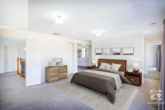 21 Thorneycroft Avenue Wodonga VIC 3690 $725,000 to $750,000 With a commanding and stately presence, this 2011 built home is sure to grab your attention. Situated on a spacious 855m2 block, offering four bedrooms, two and a half bathrooms and four living areas, this impressive home has been elegantly designed to accommodate the needs of an expanding family. As you enter the home through the double wooden doors, the impressive foyer greets you with an elegant staircase and stunning polished tiles. You will find the formal lounge room to your left and the home office or study to your right, both bathed in natural light, overlooking the quiet street front. The grand staircase leads to a central living space upstairs, with all four bedrooms and the main family bathroom adjoining. Space is luxury, and this master suite will not disappoint. With double glass doors opening onto the private balcony, a huge walk-through robe and a generous, luxury ensuite, this master is the pinnacle of comfort. This kitchen is a chef's dream, with ample storage options, a huge walk-in pantry, stainless steel appliances, including a 900mm wide oven, and stunning stone benchtops. The spacious open plan kitchen, living, dining flow out through glass doors to the undercover alfresco area. With space for all the family, the generous rumpus room is versatile and would make the perfect kids play area or home theatre. The backyard is very low maintenance with plenty of scope for a future pool or shed (STCA). The double lock-up garage can be accessed via the internal door through the laundry or backyard through the single rear door. With 321m2 of living space, what more could you ask for?