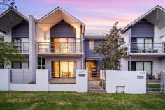 2/27 Noalimba Cres Bateman WA 6150 Located in the prestigious Noalimba Estate, this low-maintenance lock and leave home is within walking distance to Bull Creek Train Station and local parklands, along with the added benefit of being within the sought-after Rossmoyne Senior High School zone. Neat and unassuming from the outside, this property will impress from the moment you enter. The open plan meals, living and kitchen area features easy-care timber flooring and is flooded with natural light. The modern kitchen offers quality stainless steel Blanco appliances (including a gas cooktop), a generous island bench and an abundance of storage, with stone benchtops throughout. This living area conveniently extends in to the tranquil, north-facing rear outdoor entertaining space, perfect for summer barbeques or as secure area for kids and pets to play! This ground-floor also features a separate laundry, powder room, and a generously-proportioned Home Office/lounge/fourth bedroom option. Upstairs, there are three good-sized bedrooms with the large master bedroom comprising a walk-in robe, en suite with full-height tiling and private balcony. The minor bedrooms each contain mirrored built-in robes, full window treatments, and ceiling fans, and one offers a study nook with built-in desk, floating shelf, and overhead cupboards. Also on this level, the main family bathroom offers a separate bath and W/C. Additional features of this fabulous home include high ceilings, ducted reverse-cycle air conditioning, understair storage, a secure double lock-up garage with adjoining workshop/storeroom, and automatic reticulation with near-new controller. Surrounded by high-end properties, this property is centrally-located in close proximity to Fiona Stanley Hospital, Murdoch University, Westfield Booragoon, parks, primary schools, and a host of public transport routes.