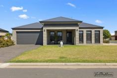 9 Mitchel Dr Yarrawonga VIC 3730 $749,000 Exceptional quality near new home, positioned on a corner block in a fantastic street. As soon as you enter you are welcomed by the tasteful interiors. The large main bedroom with its opulent ensuite and walk in robe is really lovely. The study or extra lounge area is multifunctional. Walking through to the min living area you will be delighted with the light and brightness of the home. The quality fittings in the kitchen, the stone bench tops, and the amazing butlers all contribute to a kitchen that will please any cook. From the living/dining rooms are 2 more bedrooms, one with BIRs. The full bathroom is impeccably styled. Plenty of storage in the laundry. Evaporative cooling and gas heating to keep you comfortable all year round. The low maintenance, well-manicured yard with watering system gives you a lovely street view from any window of the home. This beautiful home is perfect for the family wishing to downsize or the perfect holiday home.