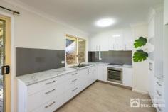 Unit 1/5 Holly Rd Wattle Tree Place Victoria Point QLD 4165 $469,000 Located on the water side of fabulous Victoria Point this spacious brick and tile duplex has a beautifully renovated kitchen, large lounge room and two really good sized bedrooms with excellent built in wardrobes. There is a separate toilet next to the large bathroom and modern floor coverings to the living area. The home benefits form a separate laundry and an internal door from the single auto door garage. There are adjustable external shutters to all front windows. Outside you have an undercover Patio and good side access into the back yard for your caravan/ boat. You are only a few minutes drive to two shopping centres, library, cinema, numerous cafes, restaurants, beautiful Moreton Bay and much more.. This home ticks a lot of boxes and any buyer will be impressed, so contact me today to arrange your appointment to view, you will love living here! Situated in South East Queensland, Victoria Point is a lovely Bayside suburb enjoying a sub-tropical climate most of the year, with a good sense of community values and everything at your door including, fantastic Bay walks with beaches at low tide. There are several schools, Doctors, shopping complexes, restaurants and cinema. Ferries run regularly from Victoria Point to Coochiemudlo Island where you will find golden sand and unspoilt beaches, soaring sea eagles above with turtles and dolphins in the bay. Close by there are private & public hospitals. Yet, just 35-40 minutes by road from Brisbane City, the International Airport and the Port of Brisbane. There is also a good transport infrastructure to the Gold Coast and Sunshine Coast, a train station within 15 mins plus the islands of Moreton Bay are easily accessed via ferries.