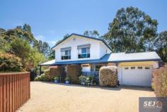 43 Pioneer St Foster VIC 3960 Superbly presented spacious home amidst stunning established gardens on approx. 950m2 of land, with the Golf Course opposite and creek at the rear, it is hard to believe you are just a 3 minute walk to the centre of town. Formal entry opens into large open plan living space with magnificent solid timber polished flooring. Filled with natural light and comfortable year-round with energy efficient RC/AC. Beautifully appointed kitchen with stainless appliances and breakfast bar to dining area. Sliding doors open into an enclosed sun room, just the spot to sit and watch the bird life enjoying the garden. Huge master bedroom downstairs with walk in robe to semi-ensuite. Separate w.c. and laundry / utility room. Upstairs 3 large fitted bedrooms and a central family bathroom. Outside, the delights continue with a lock up auto garage with storage space and rear roller door. Fully fenced rear garden with magnificent canopy of established trees underplanted with lush rainforest plants and colourful displays. Workshop, potting shed, water tank, veggie beds. Surround yourself with nature in this picture perfect setting.