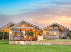 103 Morava Drive AMBERGATE WA 6280 This well thought out home design began with a dream, creativity, ethos and plenty of experience collaborated together to form an early concept into a realisation. Boasting around 400sqm of custom home built on a 5017sqm block with uninterrupted farmland views to the north from numerous living zones, this property is loaded with features. Its functional and efficient design allows a low energy output to keep the family and guests comfortable all year round and was constructed with sustainability in mind. The design forms part of the early concept of interactive living zones and indoor/outdoor social hubs whilst maintaining privacy. The architecturally designed folding roof gives it both individuality and a stylish modern appearance, whilst enabling it to perform outstandingly as a passive design inside and out. A grand entrance features a mixture of stone masonry and feature timber craftsmanship, with glass to capture the natural light. You will be delighted by the feature Marri timber flooring and the polished exposed aggregate concrete flooring, seamlessly interacting with the spacious and bright open plan living. High raked ceilings follow the folding roof and all kept cosy with the ambience of a slow combustion fire. The kitchen with its quality appliances is a delight for the budding Masterchef or the entertainer, allowing social interaction accompanied with both space and style you can enjoy. Overhead cupboards and abundance of drawers and storage, large island breakfast bar with neutral tones are just some of the quality features. The master suite at the front of the house is comprised of a separate study/office, a big walk-in robe and a luxury en-suite with double vanities. Another separate living area fitted with double cavity sliding doors creates a perfect theatre/music or games room. Privacy for the kids includes another separate wing of the home where you will find an additional 4 spacious bedrooms, all with built in robes, separate bathroom with laundry chute, powder room, linen storage and a versatile activity area offering another great living space for kids and guests alike. Outside fun and entertaining this summer will be a delight on the alfresco with plenty of space and sunshine, a fantastic northern outlook over rural farmland. Surrounded with a variety of fruit tress (plum, orange, apple, citrus, peach, almond and olive to name just some), raised vegetable gardens, water tank (13,000 litres) and a massive freestanding 3 bay garage with workstation, storage room and amenities (approx.118sqm) fitted with solar panels, adds to the list of desirable features of this exceptional customised home. Offering space inside and out, architectural style and design, comfort and character this spectacular property is sure to impress upon viewing. Internal features include: • Exceptional architecturally designed solar passive house smart home • Feature timber front door opening on to stunning marri wood flooring, leading on to polished concrete • Seamless flow of indoor/outdoor living area through stacked glass sliding doors to decked gabled alfresco with relaxing views over farmland pastures • Showcase vaulted ceilings in living areas and high ceilings throughout • Light and bright open plan living area comforted by ceiling fans and imported woodfire heater • Beautiful open kitchen overlooking living area equipped with 900mm gas cooktop, wall oven, walk-in pantry, large island breakfast bar and an abundance of cupboards and drawers. • Built-in Robinhood ironing station at end of breakfast bar opposite laundry • Large separate living area with cavity sliding doors ideal for theatre/music/games room with feature high ceilings • Master suite with private study/office, walk-in robe and ensuite • All additional 4 bedrooms are oversized with built-in robes • Separate powder room and activity area to service guest wing • Spacious second bathroom with bath, shower, vanity with plenty of cupboards and laundry chute External features include: • Circular driveway for easy accessibility for vehicles and guests • Triple bay garage with work station, storage, amenities • Solar panels for energy efficiency • 2 Instantaneous gas hot water systems • Extensive exposed aggregate • Established gardens and lawn • Variety of fruit trees (Apple, orange, nashi, plum, almond, olive, mandarin, lemon, mulberry, peach and nectarine) • Raised vegetable gardens • Rainwater tank (13,000 litres) • Garden shed