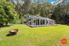 53 Lovetts Road Korora NSW 2450 As you make your way up the driveway and approach this home, you start to get a sense of the exclusivity of its address. Nestled amid the natural beauty of the Orara East State Forest, this premium location not only affords you the ultimate in privacy but also the most magnificent never-to-be-built-out valley and ocean views. This impressive timber built 2 level, 4 bedroom, 2 bathroom home has been finished to exacting standards. Each level enjoys its own spacious deck to while away the day and enjoy the calming views and peaceful surrounds. Designed to laze for hours soaking it all up, the deck also accommodates outdoor dining and BBQ. The entire home is beautifully constructed and impeccably maintained. A combination of pine and hardwoods come together to create a truly incredible home. Mixed hardwood floorboards inside and clever use of eco-deck long life decking outside in the wet areas ensure minimum maintenance required. A well-appointed kitchen with stone benchtops and stainless steel gas appliances flows seamlessly into the spacious dining area. Bedroom 2 holds pride of place with the stunning views to wake you in the morning. The grounds of this property are absolutely stunning with several garden paths offering a selection of fruit trees and natives. Wander around this magnificent property in awe at the absolute beauty in every direction. The property also comes complete with the bonus of a fully renovated multi room studio/workshop that includes a brand new kitchenette and bathroom. This studio could be used for several purposes and could be rented out to provide extra income. The studio is private with stunning escarpment views and a large wraparound deck to take advantage from any angle. This property is a once in a lifetime opportunity to own a large parcel of land with both valley and ocean views. This truly is a place of beauty.