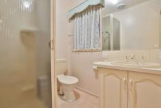 1 Wanera Way Mildura VIC 3500 $450,000 - $495,000 Team Hermans at Ray White Mildura is proud to present this unassuming property, in a popular westside location and a street in particular that is rarely seen to the market! This one is full of hidden surprises and just gets better the more that you look! A modest facade, yet attractive and immaculately kept, this three bedroom home holds a formal entryway, formal lounge room, formal dining space and an additional family/sitting room plus a light filled second meals space with bay window off a central kitchen. The classic, timber kitchen is well serviced with gas cooktop, electric oven and dishwasher to service the whole family. The master bedroom provides a walk-in robe and en suite bathroom, whilst bedrooms two & three (with built-in robes) are positioned at the opposite end of the house, for ultimate privacy. Outside continues to separate this home from the rest with a double carport, semi-enclosed with an automatic tilt-door on each end; access is provided through here in addition to the traditional side access for the caravan as well - drive straight down to your large shed with concrete floor, lights & power. You'll spot an array of outdoor entertaining space with convenient pull down blinds but additionally you'll be surprised with the extension on the shed - another outdoor entertaining area with a resort style vibe. Overhanging grape vines, an evaporative air con, wood fire heater and additional toilet & sink nearby. All these spaces make you feel like you're nowhere near town, yet you're only minutes to the Murray River & CBD.