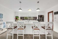 18 Tulipwood Circuit Boyne Island QLD 4680 $439,000 This former display home built by Gordy Lawrie was initially utilised as a sales office at the development of this new estate, Riverstone Rise commenced. Smartly designed, with a large tiled outdoor entertaining area which is accessed through double sliding glass doors and an added bonus is the double gate side access. • Open plan design with 600x600 floor tiled space; Low set brick with colorbond roof built in 2013 with a flat block size of 576m2; • Door and hallway separates the three bedrooms and bathroom at the rear of the home; • Kitchen displays a wall oven and electric hot plates encased in stone bench tops; An extended glass panel as the back drop to the kitchen benches; A descent size walk in pantry with a load of shelving for storage; Dishwasher and breakfast servery; • The entire home has security screens; • Split systems in the main bedroom and living area with ceiling fans in all rooms; • Large master bedroom and stylish double size walk in shower and separate walk in robe; This particular location in Tulipwood Circuit is surrounded by similar locally built quality homes. This growing community is expanding with a more homes being built for home owners. There are well planned walking pathways and a large expanse of water to bring wildlife to this area, such a peaceful and relaxing location. Just a 5 minutes drive into Boyne Island for shopping and the beach and a daily bus service to cater for the school kids and it's an easy 15 minute drive into Gladstone.