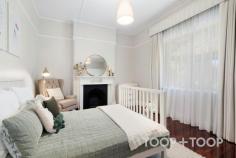 14 Shearer Street Kilkenny SA 5009 Surrounded by lush, manicured gardens, this classic character bungalow offers the dream lifestyle in one of Adelaide’s fast-growing suburbs. Just one street from West Croydon, this property offers exceptional value whilst still being moments from Queen Street Café, a short drive to North Adelaide and merely 4 train stops from the CBD. An impressive entrance exudes grandeur and leads though to the large open plan kitchen, dining and living, the ultimate hub of the home. A quality timber kitchen makes cooking a breeze, whether for one or an army. Packed full of features including gas cooking, wall oven, ample storage, and bench space plus breakfast bar. Outside, a massive gabled pergola is the perfect setting for entertaining an endless amount of friends and family in year round comfort. Side access from Downer Street allows for this space to double as vehicle parking. Accommodation is comprised of three huge bedrooms, all with original fireplaces and built-in-robes. The main bathroom has been stylishly renovated with large vanity, glass shower screen, bathtub and dual shower heads. Possessing heart-throb period charms such as polished floorboards, picture rails, lofty ceilings and original fireplaces, this home is true to origins. A property that has been loved unconditionally by the current owners and is now ready for its next custodians. A rare chance not to be missed!