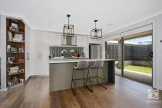 11 Hampshire Boulevard Leneva VIC 3691 $489,000 Built meticulously by Sapphire Sky Homes in 2019, this well-presented home is near to new. Save yourself the time it takes to build, and purchase an already established master built home. Well presented, this property is the ideal option for the small family, downsizer, or astute investor. With excellent tenants in a secure lease until June 2022, at $410 per week, this property is yielding well and will appeal to homeowners prepared to wait for a June move-in date. With a throughout floor plan, the living and dining area create a central hub, incorporating the stylish kitchen with stainless steel appliances, a gas cooktop, an abundance of bench space, and storage options. Comprising of three oversize bedrooms, all including built-in storage, the thoughtful design offers ideal separation and flexibility for the family. The master suite, positioned at the front of the home, enjoys views of the mountains. Complete with double built-in robes and a stylish ensuite with a large double rose shower and separate toilet. A large, pristine bathroom with a separate bath, shower, and toilet, has the family covered. Oversized, the laundry is directly accessible from the garage, making the home very functional. The double garage offers internal entry and rear yard access via a roller door. The courtyard garden is fully irrigated, with a grassed area for the kids and pets to play. A covered alfresco area located off the dining room expands your entertaining options. The front yard is fully landscaped, with low maintenance gardens and a lush green lawn. With no expense spared, this well-designed home ensures comfort all year round with ducted gas heating and evaporative cooling, a solar boosted gas hot water system, and all on a very manageable 364m2 block.