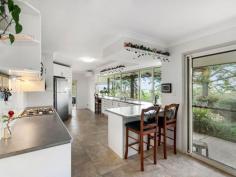 504 Binna Burra Rd Beechmont QLD 4211 This is an opportunity for someone to not only buy a beautiful, comfortable home for themselves, but also be able to have a business right there at home with a B & B, as the configuration of the rooms allows this to be easily managed and utilises these spaces for private and welcoming self contained accommodation for several guests at once. But this isn't a sale for the already running B & B, this is a chance for you to buy a property that allows you to follow in the sellers footsteps, or not. You might simply wish to bring the family together in this beautiful, comfortable home to live close enough to share your lives, but with privacy enough to feel you can still enjoy your own space. It is set up with 2 ensuited studio apartments attached to the main house and a 2 bed cottage with bathroom and small kitchen. Main house- 3 beds plus study/4th bedroom and 4 bathrooms (this includes the 2 studio apartments) 3 living areas plus enclosed verandah as an additional sunroom/studio/office Large laundry area in a fully screened verandah Solar HWS on roof- 300 ltrs installed Nov 2020, plus small solar power system Gas Cook top and elec oven, pantry, long bench top facing windows with view to Mt Tamborine Air con unit Master bed has walk in robe and ensuite The family bathroom is off the study/4th bedroom The 2 studios have their own ensuites and are large enough to accommodate a small lounge and table and chairs plus both have a small kitchenette These are separate to each other, but are connected to the house, accessed through lockable doors. Between these 2 studio apartments is a linen closet with access from either side- very clever idea for ease of access. It also means the 2 studios can be interconnected if you want to use it as part of the main house. The house has 4 x 22,700 ltr water tanks. The 2 bed cottage is attached to the workshop/garage. With a good sized lounge/dining/kitchen area and 2 good sized bedrooms, insulation and verandah across the back of the bedrooms makes this cottage comfortable and cool. The property itself is mostly cleared and gently slopes down toward the back fenceline. A veggie garden and small orchard and beautiful house yard gardens and sitting areas, with firepits, makes this a fabulous family home or family business without any work to do for set up. For the right price, the owners would consider leaving some furniture items. Never attended an auction before? Let us guide you through the requirements and experience so you too can be in the running to secure one of the beautiful properties that is sold under the hammer. We can step you through how the auction works, what is required in order to bid and how the sale of the property will proceed. Do not let an auction turn you off. Plus it is the sellers right to accept an offer prior to the auction. As part of the requirements of an auction your offer will be based upon your viewing and your own assessment of the properties worth. We do not provide you with a price guide. Come and live on the mountain, with cool, clean air and plenty of room.