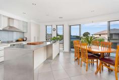 1/4A Cole Street Kiama NSW 2533 Perched high in a quiet street, capturing ocean glimpses and cool sea breezes; this stunning, eclectic style home is a must see! Built by quality builder Paul Kirk you will be amazed by the design which maximizes space and boasts luxury. You will love the versatility the clever floor plan offers, perfect for a small family, couple or even a single. Flooded with natural light and floor to ceiling louver windows, stacker doors and a favourable east, north/east aspect. Two living area which both flow through to the outdoor areas the font is tiled and perfect for summer, the back is a suntrap for cool winter days. Featuring a gourmet kitchen with stainless steel bench tops, Bosh and Klein Maid appliances and a fitted out pantry. The bathrooms showcase floor to ceiling tiles and a beautiful deep bathtub to soak away the stress of the day. This home is modern, easy care and ready to enjoy with no maintenance required.