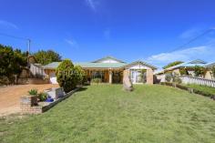 12 Henry Place Castletown WA 6450 $499,000 This supersized family home displays wide open entry into formal lounge and master bedroom with walk in robe and ensuite. The huge open plan living encompasses kitchen, dining and family areas. French doors lead through to passage where there are 3 bedrooms with robes, 2nd bathroom, laundry and 5th bedroom/study. Double garage under main roof with drive through access to single brick garage/workshop. Rainwater, bore, ceiling fan, 2 x aircons and tile fire.