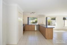 144 Ocean Keys Boulevard Clarkson WA 6030 If you are looking for a good size home with an easy walk to the train station and Clarkson shops, schools and parks, then this is the house for you! Set on an elevated block, this neat and tidy low maintenance home is ready to go. Past the enclosed front garden and security door, you enter the extensive lounge area, great for entertaining and theater room. Containing good size windows, plenty of electrical sockets and T.V. point, its sure to please. The master bedroom is again on the large size and benefits from an excellent walk in robe and ensuite, with a roller security shutter for extra privacy. The main living space is the open plan kitchen/dining/living area where the 194 sq/m floor plan really offers much more room than a standard 3×2 in the suburb, filled with light from the row of windows and rear sliding security door. There is a dining area to one side and then the open plan living facing the kitchen, with it’s gas bayonet, another T.V. point and plenty of options to suit your requirements. The kitchen contains a good size pantry, fridge recess, 600mm oven and burners, double sinks, dishwasher, plenty of storage, all heated/cooled by a large split system air conditioning unit. The two additional family bedrooms are on their own wing of the house. Both are large in comparison to similar properties in the suburb. Plenty of light fill these bedrooms, with their built in robes and carpet. They are serviced by the family bathroom with it’s bath, shower and sink combination and a separate toilet. The laundry is again large and offers easy access to the garage. The outside fully fenced garden, enjoys the additional patio for year round entertaining, low maintenance poured limestone and established plant beds which are fully reticulated. There’s even another door to enter the garage, just great for bringing home any new plants or pots for the garden. Finally, there is a locked gate to the side of the garage for all those items you want to keep out of sight. This is a large home in a great location – be quick it won’t be For Sale long.