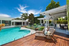62 Killarney Drive Killarney Heights NSW 2087 62 Killarney Drive, Killarney Heights is proudly presented by Brian Fairweather of Ray White Fairweather Group. This property has been SOLD Prior to Auction. For more information, contact Brian on 0402 938 870 or Irina on 0405 158 265. This harbourside home is situated across from Garigal National Park on a sought-after street. This mid-century modern property features a manicured rear garden with several private entertaining areas and a sparkling pool. The open plan interior flows out to a front deck with views to the Roseville Marina. Meticulously crafted for a lifestyle centred around family entertaining, this sophisticated, resort style retreat on 702sqm features exquisite attention to detail, from the manicured topiary gardens to the flowing, easy care interiors. The jewel of this home is the sparkling solar heated, saltwater pool and the raised outdoor living platform resplendent with full BBQ kitchen and automatic Vergola. Its exclusive address is directly opposite the lush tranquil expanse of Garigal National Park, with leafy views from the expansive terrace to Roseville Marina and the North Sydney skyline. Despite its chic holiday vibes, its convenient setting is just around the corner to Killarney Heights shopping village, schools and Chatswood/city buses. Sunlit spacious living with raised dining and a full wall of east facing windows Family sized kitchen with Miele oven, integrated dishwasher & Asko gas cooktop Additional living with bespoke cabinetry opens to generous timber terrace Four bedrooms with built-ins, each flowing outdoors; Master with skylit ensuite Modern bathroom with frosted glass shower, separate WC, laundry cupboard Six car garage includes studio space and temperature controlled wine cellar Ducted, zoned reverse cycle air con, timber flooring, workshop space Our offices: Ray White Killarney Heights / Ray White Narrabeen / Ray White Frenchs Forest.