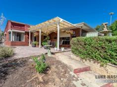 23 Onyx Road Mount Richon WA 6112 $500,000s Where do i start? This potential packed property has so many options, one or all of them will suit your needs. 1/ This can be a three bedroom, two bathroom house with an attached one bedroom one bathroom granny flat, with a sitting room. Or 2/ A four bedroom two bathroom home with a one bedroom, one bathroom granny flat without the sitting room. Or 3/ A five bedroom, three bathroom house utilising the granny flat as part of the home, with two kitchens. WOW. This amazing property is ideal for a large family (Brady bunch) or extended family incorporating the granny flat for Mum and Dad or a great investment property as you can rent the two properties separately. IT’S YOUR CHOICE! The property is situated proudly on the top of a large elevated 873m2 block, which allows you to take in the valley vista from the front courtyard and rear elevated grassed area. The property is partly hidden from the street which offers privacy and it is so quiet you can hear a pin drop. Features of the amazing house include: Double carport with side access to the property – Lovely front courtyard to sit and ponder – Warm welcoming formal entry – Large formal lounge /TV room with dining area, amazing quality Axminster carpet and direct entry to the kitchen – Front master suite with built in robe and super modern ensuite – The hub of the home is the open plan living area with gorgeous feature chefs kitchen with island bench and breakfast bar, dishwasher, stunning over head lights and a large fridge recess – The family room is expansive with a separate meals area and a toasty feature wood heater for those chilly winter months – All the guest bedrooms are at the rear of the home with robe recesses, serviced by the large original bathroom with separate bath and shower – A fourth bedroom is an option but is now the sitting room to the granny flat. Granny Flat features : Access to the main property through the communal entertaining area or directly from the house through the original fourth bedroom – Sitting/TV room – Small meals area adjacent to the spacious kitchen – Massive master bedroom that can be divided into two and an impressive modern ensuite with walk in shower – Gas heating and ducted cooling vent are fitted. Outside features include: Three great entertaining areas – Covered barbecue nook – Two sheds – large elevated grass area for the kids and pets to run amok. Other features include; Wood effect vinyl planks – Instant gas hot water – Gas heating – Gas cooking – Feature wood heater – Roller shutters to most windows – Cool ducted evaporative air-conditioning – Solar panels 5kw system – New decorative internal shutters plus more. This is a fabulous hills property offering a fabulous hills lifestyle. First viewings will be at the advertised home open. SEE YOU THERE!