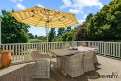 5-7 Dale St Burrawang NSW 2577 $1,995,000 - $2,100,000 Taking its place in the quaint village of Burrawang, this beautiful home is set back from the road in an elevated position and offers immense appeal to those yearning for an exceedingly comfortable, easy-care lifestyle. A recent refresh has really brought the home to life, enhancing its liveability, and reinforcing its idyllic connection to the sprawling gardens that surround it. When not entertaining friends out on the terrace or enjoying the cosy warmth of the fire, you’ll likely be sitting underneath the canopy of one of the towering maple trees in the garden, immersed in a good book with a soothing cuppa. A leisurely stroll to the main street will be a daily occurrence as you become part of this welcoming village community and relish your enviable new life. Open plan lounge and dining⎮Slow combustion stove⎮Extends to front deck Modern kitchen⎮Timber floors⎮Pantry and appliance cupboard⎮Gas cooktop⎮Dishwasher Sun-bathed front deck⎮Elevated leafy views⎮Beautiful indoor/outdoor connection Master bedroom with built-in robes⎮Built-in bookshelves⎮Reverse cycle a/c⎮Shower ensuite Second bedroom with built ins⎮Third bedroom/home office with w/c Main bathroom⎮Shower, bath, heated lighting Timber deck and paved BBQ area to the rear Ducted heating and cooling⎮Good-sized laundry⎮Bottled gas Solar panels feeding electricity and hot water Detached double lock-up garage⎮5m x 7m⎮Side access to rear Thriving veggie garden beds⎮Established gardens and trees Brick shed at the rear⎮Cute studio/second shed North-facing | 1857sqm block⎮Expansive front garden Walk to Burrawang Hotel and General Store.