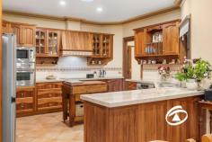27-29 The Boulevard Narre Warren South VIC 3805 $1,100,000 - $1,200,000 Standing proudly on an expansive 1156 sqm allotment within the Cypress Hills Estate, this evocative Federation home delivers comfort in a glorious period setting. Boasting a versatile floorplan that is ready to adapt to your needs, this beautifully maintained home is a rare find and proudly owned by the same family for nearly 20 years. Welcomed by an oversized entry, expansive formal lounge with gas log fireplace, separate formal dining area as well as the generous family and meals space at the rear, saturated in natural light. Incorporated into the family/meals area is the huge Blackwood kitchen which enjoys granite benchtops, quality appliances and an abundance of storage Offering 3 oversized bedrooms, master with walk-in robe and ensuite, central bathroom with separate toilet, and a home office that could be easily converted to a 4th bedroom should your needs require. With 9ft ceilings, ornate cornices, ducted heating/cooling, twin split system air conditioning, ducted vacuum and solar array to name a few of the many features. Outside is an entertainer’s paradise with enclosable alfresco, inground pool and integrated spa, poolside bar and toilet surrounded by expansive established gardens and manicured lawn. Completing the home, you will find vehicle accommodation for the whole family with a cavernous triple garage with a separate workshop and gated side access, perfect for a prized boat or caravan. Numerous visitor vehicles can be accommodated onsite via its two gated driveways. With every attention to detail and impeccably maintained, the home is sure to impress the fussiest of buyers.