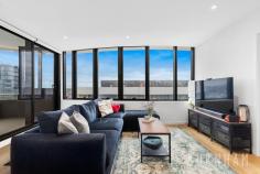 2206/8 Hallenstein St Footscray VIC 3011 $575,000 - $625,000 Enjoy awe-inspiring, unobstructed, sweeping views of the Maribyrnong River and Flemington Racecourse in this new, luxe and spacious two-bedroom apartment. Perfect for first homebuyers and investors alike. Upon entry, timber floors guide you to the open plan living and dining area. This space features curved panoramic windows that allow light to fill the room and frame the views of the surrounding landscape. Indoor/outdoor entertaining is made easy as this area opens to the entertainer’s balcony where the outlook is truly breathtaking. The homes kitchen fuses style and functionality. It boasts extended stone bench tops, Bosch stainless steel appliances, integrated fridge, hexagon splashback tiles, black hardware and an abundance of storage. The master suite is large and light filled featuring curved, wall to wall windows. It is serviced by an ensuite with a large shower. The second bedroom follows similar trends with racecourse and river views. Both bedrooms feature luxe charcoal carpeting and substantial, mirrored built-in robes. The central bathroom features shaving cabinets, floor to ceiling tiles, hexagon feature tiles, black tapware and a large shower with rainfall shower head. The apartment is completed by a European laundry and separate linen cupboard. Enjoy all the amenities Vic Square has to offer, including, the sky garden on level 4, a fully equipped gym, pool, games room with billiards table and cinema. If that isn’t enough, located only 6kms from the city, take advantage of its close proximity to everything your heart desires. Footscray’s burgeoning bar and restaurant scene, Victoria University, Footscray Train Station, the Maribyrnong River, bus and tram tops and Footscray Park are a short walk away. Additional features: – Split system air conditioning and heating in the lounge – Window furnishings – Secure intercom entry – Designated spot in secure, underground car park.