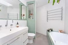 1/4A Cole Street Kiama NSW 2533 Perched high in a quiet street, capturing ocean glimpses and cool sea breezes; this stunning, eclectic style home is a must see! Built by quality builder Paul Kirk you will be amazed by the design which maximizes space and boasts luxury. You will love the versatility the clever floor plan offers, perfect for a small family, couple or even a single. Flooded with natural light and floor to ceiling louver windows, stacker doors and a favourable east, north/east aspect. Two living area which both flow through to the outdoor areas the font is tiled and perfect for summer, the back is a suntrap for cool winter days. Featuring a gourmet kitchen with stainless steel bench tops, Bosh and Klein Maid appliances and a fitted out pantry. The bathrooms showcase floor to ceiling tiles and a beautiful deep bathtub to soak away the stress of the day. This home is modern, easy care and ready to enjoy with no maintenance required.