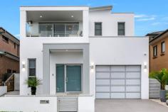 28 Jones Avenue Potts Hill NSW 2143 Buying the perfect family home vs. building the perfect family home is always a household discussion. This modern master piece makes that decision a lot easier for you. This immaculate residence offers multiple living zones, indoor & outdoor entertaining areas, five spacious bedrooms, a master bedroom taken out of a five star hotel, opulent home office, a luxurious reading quarter, ultra modern modern Kitchen & bathrooms areas, theatre room and so much more. A house of this calibre has never been bought to market in the Potts Hill Estate. A custom built home which perfectly ties together all aspects of living, entertaining & comfort. Experience the many personalities this home portrays during the day & at night so we welcome you to inspect our daylight & evening viewing sessions. Ground Level Offers: • Fully equipped theatre room complete with star lighting, projector, surround sound system & block out curtains to create the mood • Single lock-up garage with plenty of storage space • Modern main bathroom with separate laundry • As you enter through the side door you have access to custom mud-room/shoe-room • Expansive, open plan living, dining and kitchen area flowing freely through the bi-fold doors to our outdoor alfresco area combing both indoor and outdoor entertaining • Ultra modern kitchen with quality appliances, gas cooking, 60mm stone bench-tops, massive breakfast bar and plenty of pantry space • Outdoor alfresco offers integrated stainless steel gas BBQ, separate gas burner, industrial range hood, kitchenette with sink and room for a bar fridge. All this combined with a 40mm stone bench-top. The alfresco area is fitted with automatic shutters & gas fireplace built into outdoor TV unit. This area is also fitted with designer lighting & ceiling fan. Level 1 Offers: • Hotel like master bedroom for a King & Queen offering opulent walk-in wardrobe with custom joinery, led lighting, custom make up table & designer ensuite with double basin, triple shower & bathtub. The master bedroom also has a private balcony offering gorgeous district views • Modern main bathroom upstairs with shower & tub • Four spacious bedroom, two with built-in wardrobes • Upstairs living area with built-in speaker system & double sided fireplace which is duplicated in the reading quarter. • The reading quarter is lifted by a sophisticated onyx feature wall which is one of many statement pieces throughout the property. • Gorgeous custom built home office equipped with bar fridge, sink & zip tap Backyard: In ground swimming pool Beautifully landscaped gardens Property features: Multiple skylights throughout the property bringing through plenty of natural light. This skylights are also equipped with automatic shutters to block out the natural light when necessary Designer lighting throughout the property both in the indoor & outdoor areas Ducted/zoned air conditioning Video intercom system, security camera & alarm system High ceilings throughout Tiled floors on the ground & first level Timber floors used on level 2 All this is located within close proximity to local schools, parks, shops and less than a 700m walk to Birrong Station. We highly recommend you come out to inspect to really appreciate what this luxury home has to offer.
