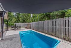 26 Butterfly Court Jubilee Pocket QLD 4802 From relaxing on the patio listening to the birds in the neighbouring rainforest, cooling off in the sparkling in-ground pool or taking your boat out in the bay to enjoy all that this picturesque region has to offer, there is so much to love about 26 Butterfly Court. This air-conditioned four-bedroom, two-bathroom home is set on a 704spm block at the end of a quiet cul-de-sac and is just minutes to Airlie Beach. With multiple living spaces as well as an extended patio with a fire pit and a large grassy backyard, this is an incredible lifestyle opportunity. The kitchen boasts an ASKO dishwasher, sweeping benches, a double fridge cavity and bench seating, making preparing meals a pleasure. When it comes to downtime, you can take your pick from the open-plan dining and family room overlooking the pool or move into the separate lounge overlooking the rainforest. The spacious master bedroom features a walk-in robe and ensuite, while the guest bedrooms have built-in robes. With a double garage as well as side gates for your boat or caravan, this home is bursting with style and appeal. FEATURES: Media Room.