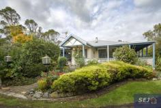 335 Hazel Park Rd Welshpool VIC 3966 $785,000-850,000 Complete privacy surrounded by approx. 4.8 acres of land with a long tree lined driveway leading you home. Charming residence amidst picturesque rambling cottage gardens, orchard, vegetable patch, 4 fenced paddocks and excellent shedding. With wide verandahs on two sides there is always somewhere to sit and catch the sun, listen to the birds, enjoy the peace and quiet. Pretty entrance foyer leads into the spacious open plan interior with easy care polished flooring. The ambience of a wood heater is combined with the convenience of RC/AC to ensure comfort in every season. Every window enjoys views of the stunning garden setting, bringing the outside in to connect you with nature. Modern kitchen with quality appliances, huge walk in pantry and island bench / servery to dining area. Light filled sunroom / studio space or study. Three double sized bedrooms, family bathroom, laundry / utility room and separate w.c. Minimal running costs with solar and mains power and solar hot water. Shedding includes a 3 bay lockable shed with concrete floor, lights and power plus a 3 bay extra height, chook pen, disused dairy and hay shed. Excellent water storage. Quiet rural location just 8 minutes from Agnes Falls with Toora (7 minutes) and Welshpool (8 minutes) a short sealed drive away.