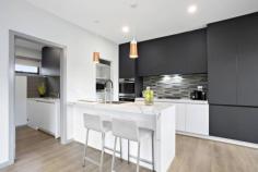 1/49 Shand Road Reservoir VIC 3073 $780,000 - $850,000 Enjoying the independent profile of its own street frontage on an allotment shared with only 2 other townhouses, this exceptional c2020 residence retains all its contemporary flair and freshness throughout brilliant spaces only moments away from Broadway. Bright living/dining areas are complemented by timber flooring, a pleasing outdoor aspect and a kitchen where stone benches, quality appliances, soft closing cabinetry and an integrated fridge and freezer reflect a focus on state-of-the-art refinement. The emphasis on style ascends to an upstairs level where 3 alluring upstairs bedrooms and 2 bathrooms include a main bedroom with an ensuite. A dedicated study space makes working from home a delight while heating/cooling keep everything supremely comfortable. Decked outdoor entertaining is desirable low-maintenance and a double garage and dual car parking are totally convenient. Close to Reservoir East Primary School, Reservoir Leisure Centre, within easy reach of Summerhill Shopping Centre and public transport options.