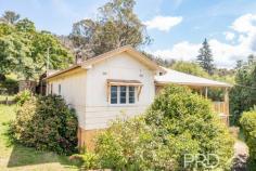74 Batlow/Tumbarumba Road Batlow NSW 2730 Perched on the high side of Batlow Road with an elevated aspect, sits this three-bedroom, two-bathroom high-set home with sprawling views of the picturesque hills of Batlow and surrounds. Set on over 1,700m2 low maintenance allotment and boasting a wrap around deck that capitalises on the picturesque views, you will love coming home to this freshly painted and updated home. Do not miss your opportunity, call today to book your private inspection. Premiere Features: - Three good sized bedrooms - Main bathroom with separate shower, toilet and single vanity - Spacious ensuite with separate shower, toilet and single vanity complimented by a large frosted glass window perfect for sun filtering through - Perfectly positioned sun filtered kitchen with electric cooktop, good storage and bench space options that flow seamlessly to the open plan dining and direct access to the front deck - Open plan dining area with new flooring - Quaint separate study area or storage - Laundry area to the rear and under roofline - Wrap around entertainers' deck with a picturesque elevated aspect - Single lock up and detached garage to the front of the property - Additional double carport to the rear allowing the ability to drive straight up to behind the home - 2 x rainwater tanks - Gas heating options - VJ timber feature panelling throughout - Sash and casement windows - Secure under house storage options - Dual access points from Batlow Road - 1,701m2 low maintenance elevated allotment - Current rental assessment $280 - $300 per week Do not miss your opportunity to secure such a great property in an elevated position in the picturesque township of Batlow, call today to book your inspection.