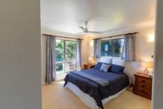 29 MIFSUD DRIVE SARINA BEACH QLD 4737 $720,000 When inspecting, please enter "Misfud" into Google - incorrectly spelt on all Google sites). A bitumen 20min drive from the City Gates presents this immaculately maintained property, tucked into the summit of a hill with panoramic views, constant ocean breezes, abundant soil, a well-designed family home & sheds to accommodate multiple vehicles or machinery! The four-bedroom home offers views from every window & boasts a neat ensuite off the master. All bedrooms are well-sized with three of the four having built-in wardrobes with fans, carpet & air conditioning. The fourth bedroom is currently used as an office & storage room but could easily be converted if wished. Upon entry, the lounge is defined with interior dark brick arches that have the effect of an open space, leading to the open plan dining room & flowing into the well-appointed large kitchen. Cook for days with endless views of the mountains whilst enjoying ample bench space & plentiful overhead & underbench cupboards. The breakfast bench is at the entry of the kitchen & is fantastic for casual cuppas or kids doing homework. Right beside the breakfast bench is internal entry into the house from the lockable garage, which is very appreciated when lugging groceries into the house. The undercover enclosed patio acts as a lovely entry area &, being surrounded with security screens, could be a beautiful greenhouse or entertaining area. Step out of the lounge or dining room to concrete covered patios where you could watch the world go by without a worry, enjoying endless views & constant cool breezes. Landscaped gardens & established abundant fruit trees/vegie patches/herb gardens are evidence of years of lovingly devoted toiling to produce the healthiest & naturalist that Mother Earth can provide! The shed will be the envy of every Man-Cave-loving-male with 10 bays (5 bays fitting 2 cars in tandem in each bay). 4 massive doors open outwards for easy access & the 5th bay has been converted into a shelved workshop/"office". With power, windows for breeze, shelving that stays, a hard-wired welder etc, move straight in & begin work immediately! Expenses are at an all-time low at this address with solar panels; 3 x 6000 gallon rainwater tanks; 2 x 6000 gallon bore water tanks; pottable bore water; septic sewer system & grey water used on the grounds for all year lushness. This property is just divine! It oozes of family memories, loving get-togethers & fantastic memories for any children lucky enough to be raised in the healthy outdoors with memories of exploring the grounds; riding the resident horse (included in the sale) & toasting marshmellows around the firepit. With a very short drive to both Sarina & Mackay, come home each day to totally switch off & relax, being so close to the beach. Be incredibly quick to inspect this tightly-held, highly sought-after beautiful family home & adopt the accompanying lifestyle of peace & tranquillity!