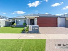18 Ornata St Byford WA 6122 $500,000 Welcome to 18 Ornata Street Byford. This absolutely stunning super size 4×2 home is located in the highly sought after ‘Glades Estate’ situated on a family friendly low maintenance 510sqm block. With a total build area of 289m2 this gorgeous home will cater for the largest of families looking for expansive open spaces and double size bedrooms. With 3 big living areas and a stunning feature kitchen with scullery, this beauty with tick all your ‘I WANTS’ Boasting features galore this quality modern home is definitely a power house of the ‘Glades Estate’ With Woodland Grove Primary School, public open spaces just a stroll away and the Strand Lakeside Cafe and shops close, everything you need is on your doorstep, making this a highly sought after family home or investment. Selling features of this stunning home include: Fabulous street facade with portico entrance – Easy care front gardens with easy on the eye artificial lawns – Double remote garage with extra wide driveway – Feature front door with wide welcoming entrance – Shoppers entrance off the hallway – Hollywood style master suite with his and hers walk in robes – Open style feature ensuite with twin sinks separate WC and an intimate double shower – Huge theatre room with feature barn door entry – Jaw drooping open plan kitchen, meals, family and games area which is the hub of the home – Beautiful chefs kitchen with a mixture of soft closing cupboards and pot drawers, Westinghouse appliances, 5 burner gas hob, electric oven, dishwasher, double fridge recess and walk in scullery WOW – Large open plan meals, family and games area – 3 double size guest bedrooms all with built in robes – Super size guest bathroom with bath and shower – Good size laundry – Separate WC – Walk in linen – Timber decked grand alfresco and shade sail area – 2 artificial grass areas, one for the pets one for the kids – Garden shed and rear access to the backyard from the garage. Other features include: Ornate floor tiles throughout the thoroughfares and living areas – Roller shutter to the front master suite – Ducted reverse cycle air-conditioning – Attractive window treatments plus feature internal Plantation Shutters – Gas hot water system plus much more.
